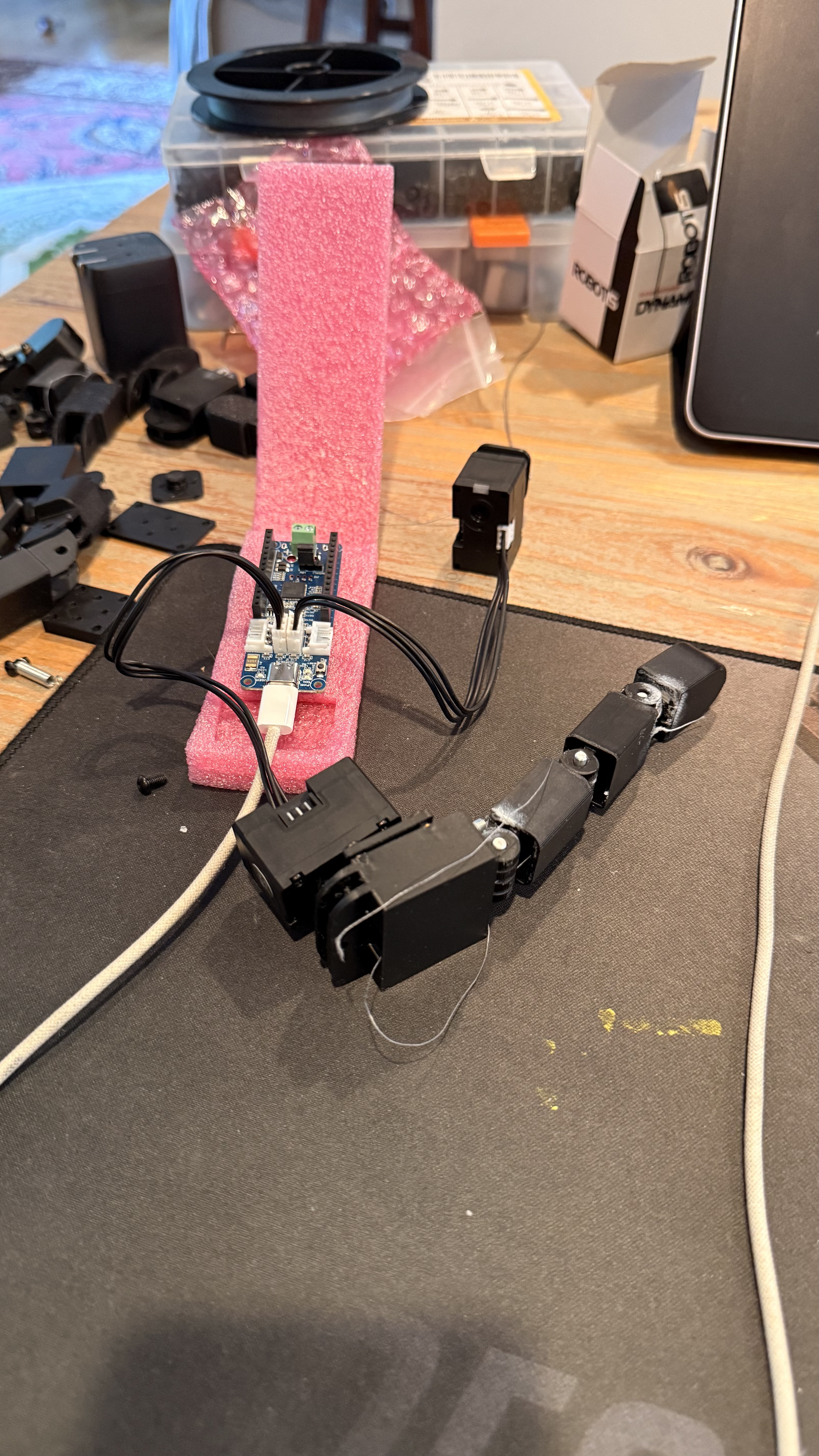 Booster Hand — index finger prototype, fully assembled with capstan joints and tendon routing